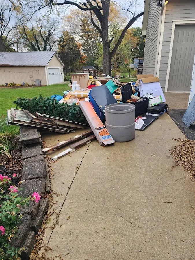 Dumpster being loaded with debris for Commercial Dumpster Rental in Newport News